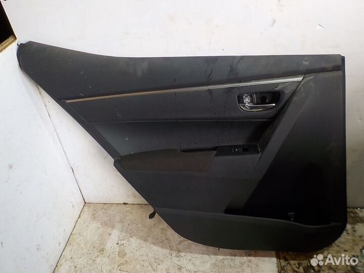 Обшивка двери задней левой Toyota Corolla 180