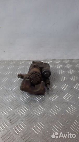 Суппорт тормозной задний левый Audi A6 универсал