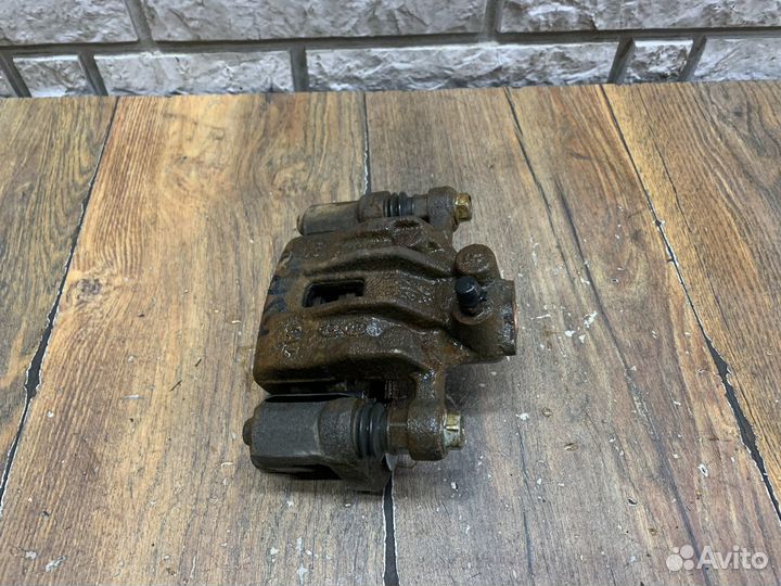 Kia Sportage Суппорт тормозной задний LH RH