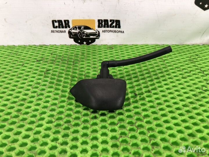 Форсунка омывателя фары левая L