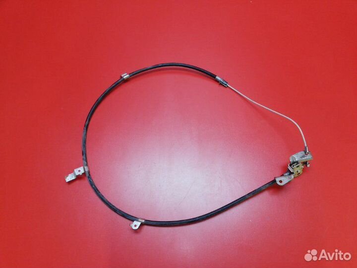 Трос стояночного тормоза передний Nissan Teana J32