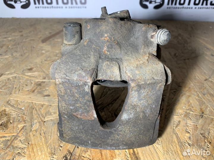 Суппорт тормозной передний левый Volkswagen Golf