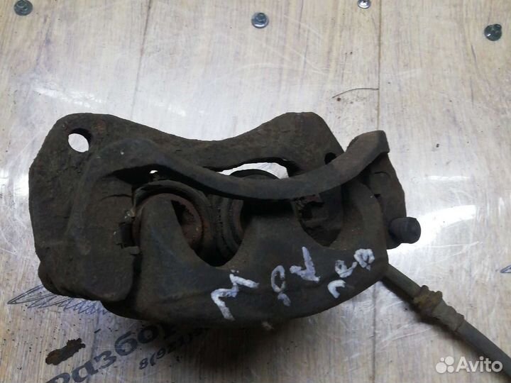 Mazda mpv суппорт передний левый