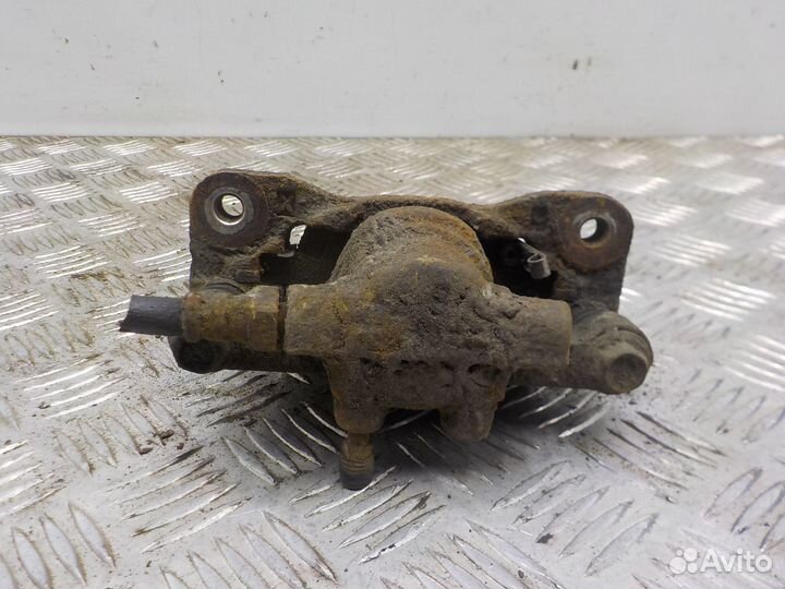 Суппорт тормозной задний левый Mitsubishi Lancer X