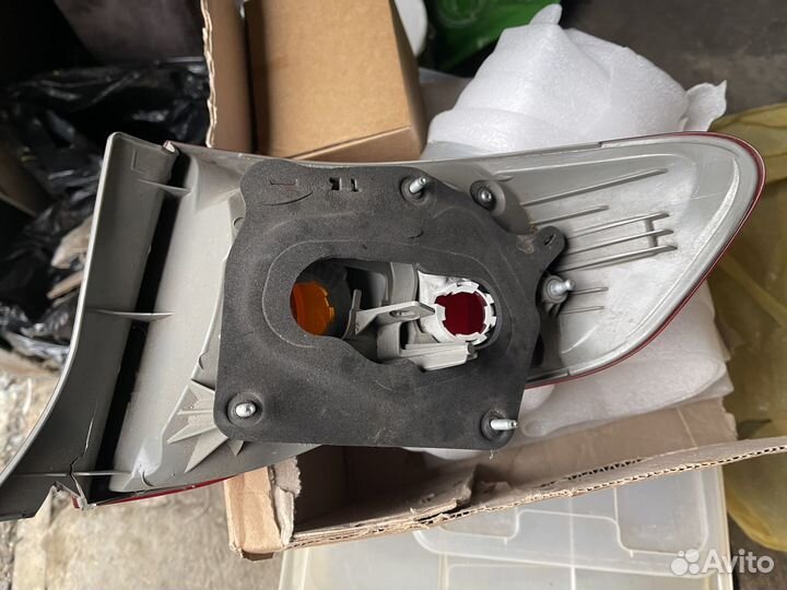 Фонарь задний левый Toyota Corolla E150 оригинал