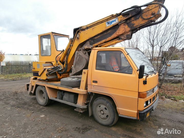 Мини-экскаватор, 1993