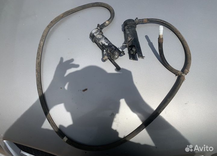 Форсунки омывателя фар Nissan Almera N16