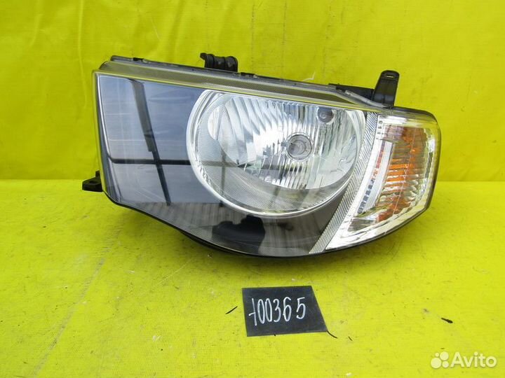 Фара левая Mitsubishi L200 05-10г 100365