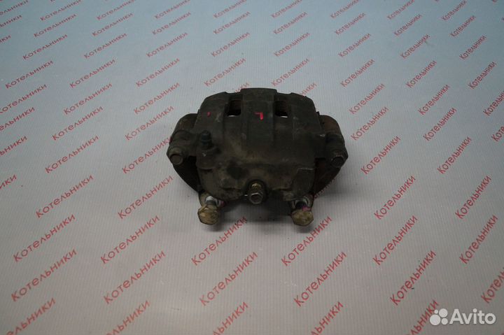 Nissan 41011-WF100 Суппорт тормозной левый