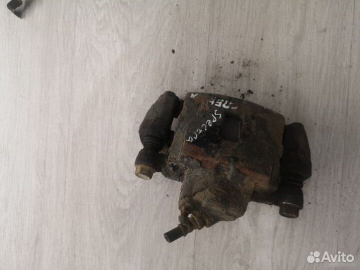 Суппорт передний левый Kia Spectra