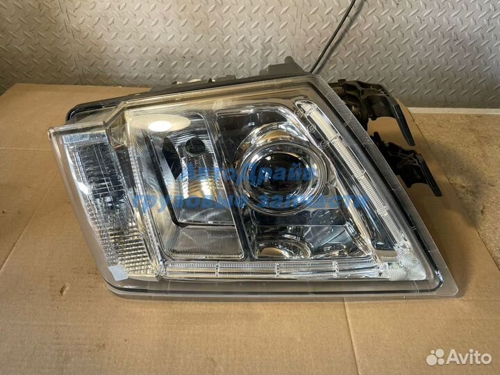 Фара Вольво FH13 левая с электрорегулировкой