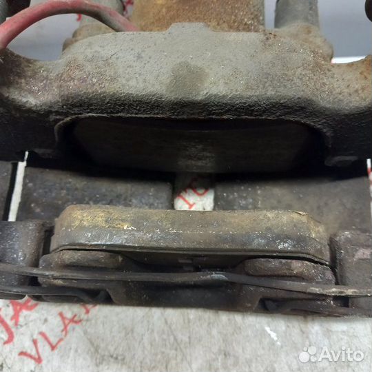 Суппорт тормозной передний левый Volkswagen Touran