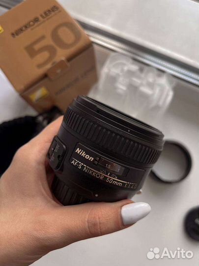 Объектив Nikkor 50mm 1.4G на гарантии