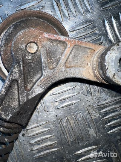 Ролик натяжитель ремня Opel Corsa D 1.4 a14xer