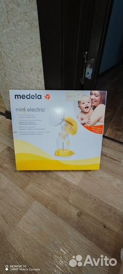 Молокоотсос medela электрический