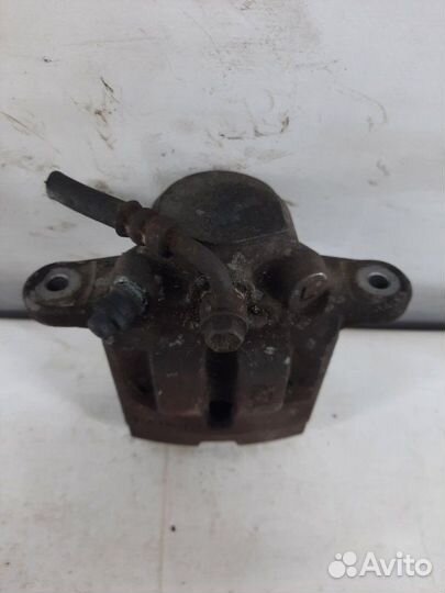 Суппорт тормозной задний левый Subaru Tribeca