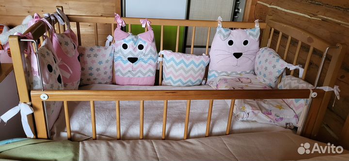 Детская кроватка с продольным маятником
