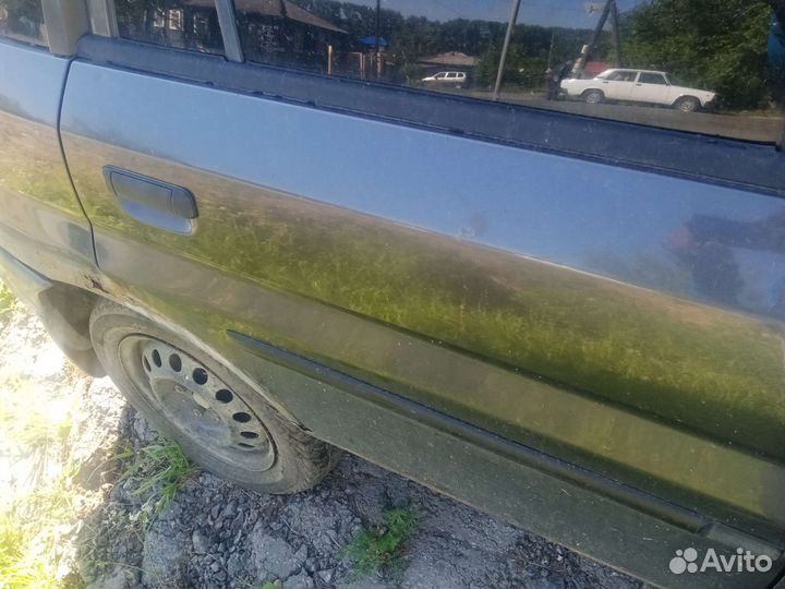 Двери mazda демио