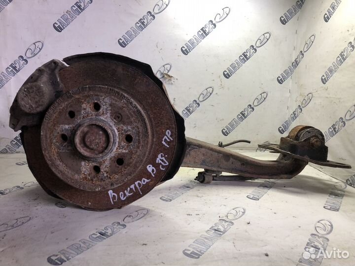 Задний продольный рычаг в сборе со ступицей правый