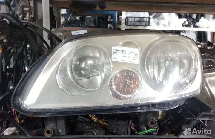 Фара левая VW Caddy 2005