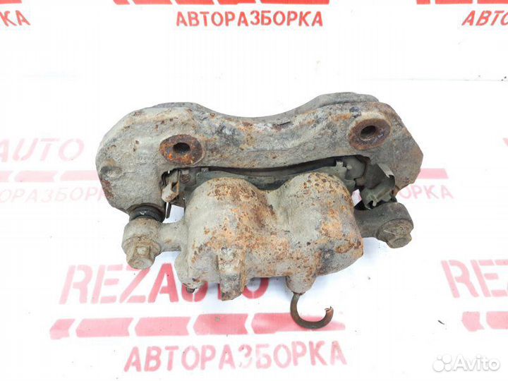 Суппорт тормозной передний левый Mitsubishi Pajero