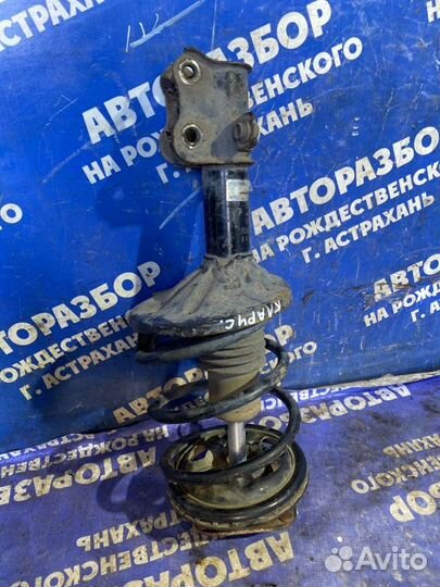 Передняя левая стойка амортизатора Kia Clarus