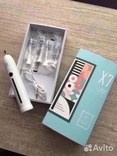 Электрическая зубная щетка