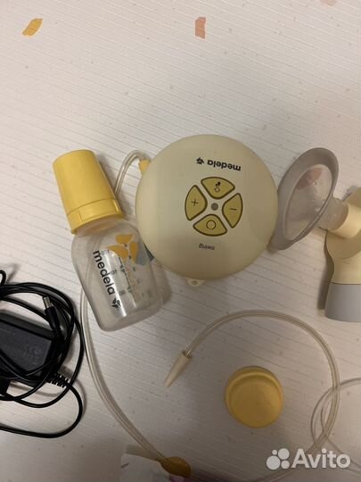 Молокоотсос medela электрический