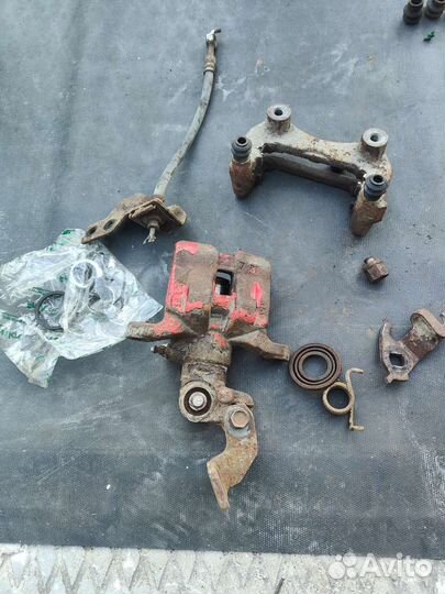 Суппорт задний левый Мазда 6