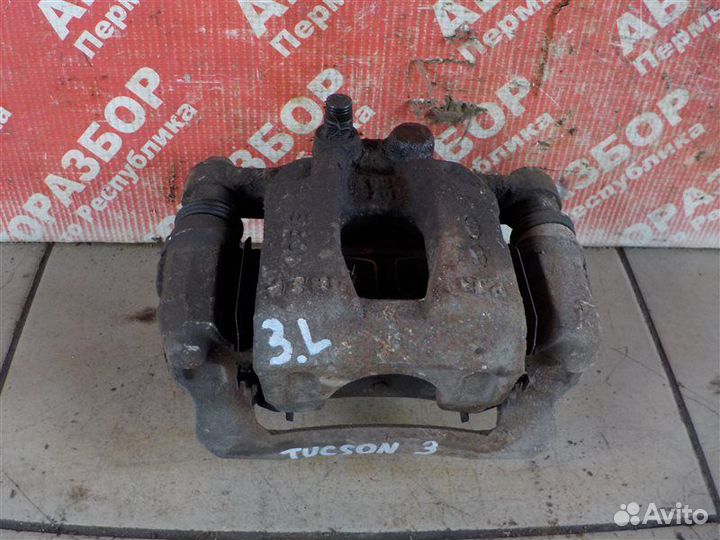 Суппорт тормозной задний левый Hyundai Tucson (W5)
