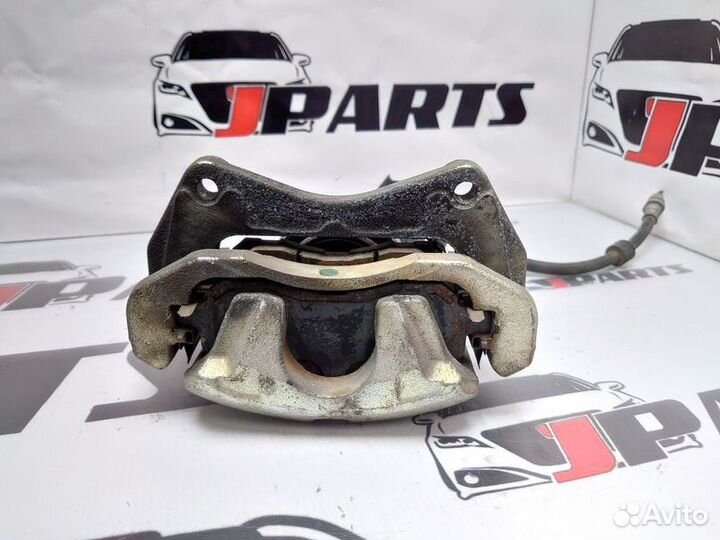 Суппорт тормозной передний Mitsubishi Lancer