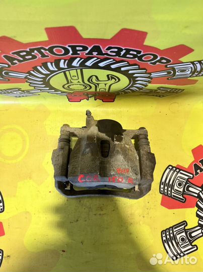 Суппорт передний правый Toyota Corolla 150