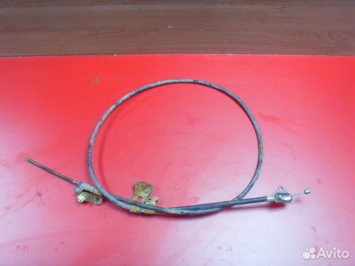 Трос стояночного тормоза 1014001818 Geely MK Cross