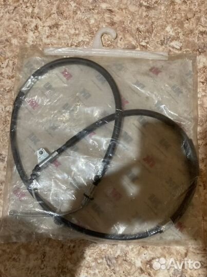 Трос ручного тормоза