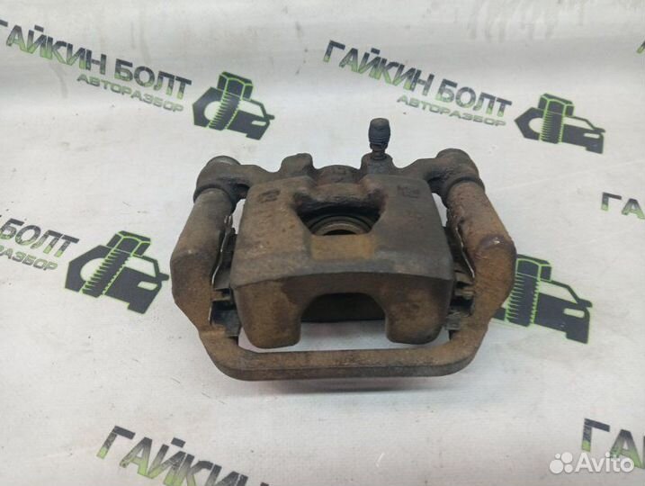 Суппорт тормозной задний левый Nissan Qashqai J10