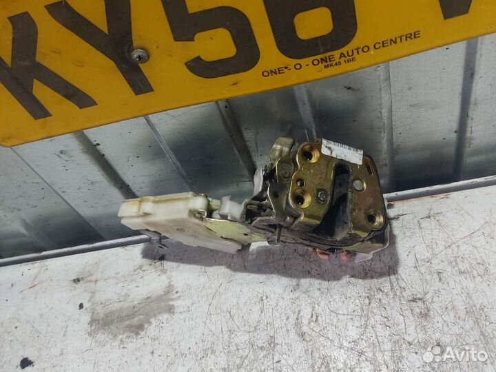 Замок двери задний левый Nissan Almera N16