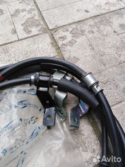 Трос стояночного тормоза kia sportage 2