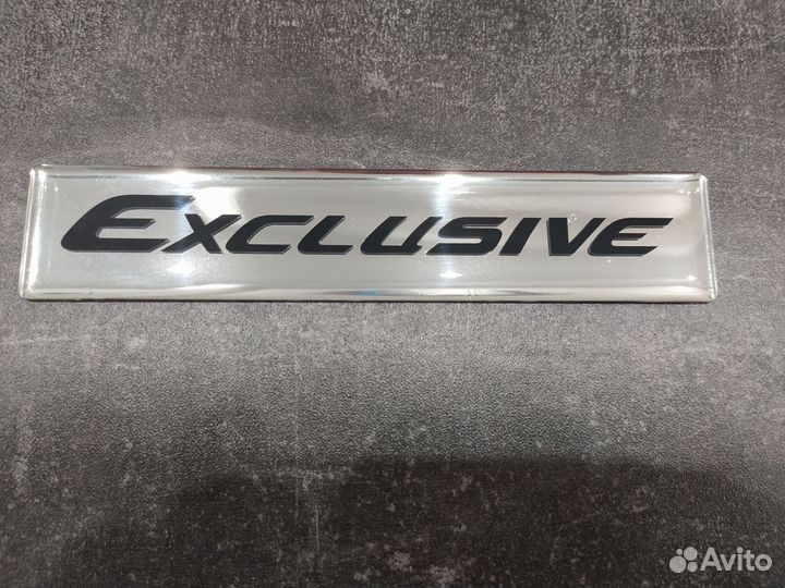 Эмблема шильдик Camry Exclusive