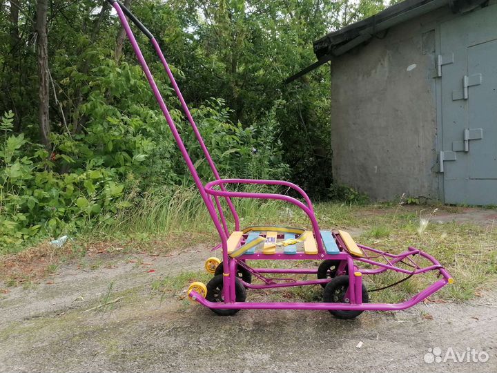 Детские санки на колёсах и чехлом