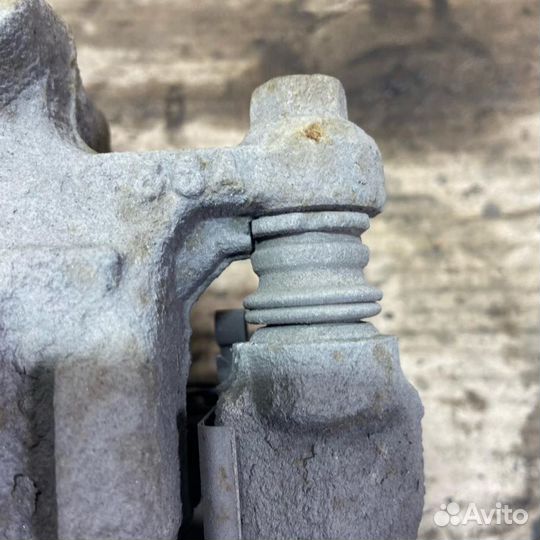 Суппорт задний левый Mazda CX-7 (ER) 2006-2012г ER