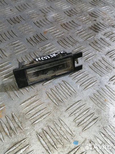 Фонарь подсветки номера задний левый Opel Astra H