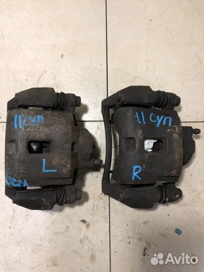 Суппорт тормозной передний Киа Спектра