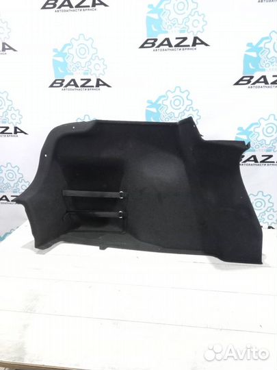 Обшивка багажника левая Kia Rio 4