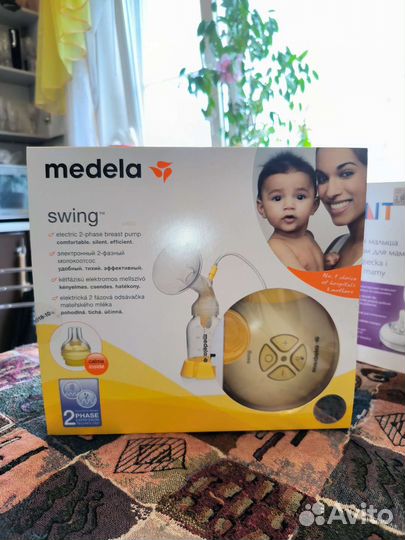 Молокоотсос medela электрический