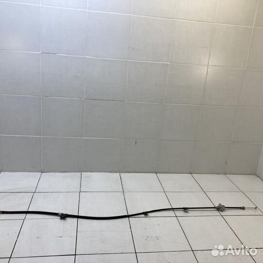 Трос стояночного тормоза левый Toyota Camry ASV50