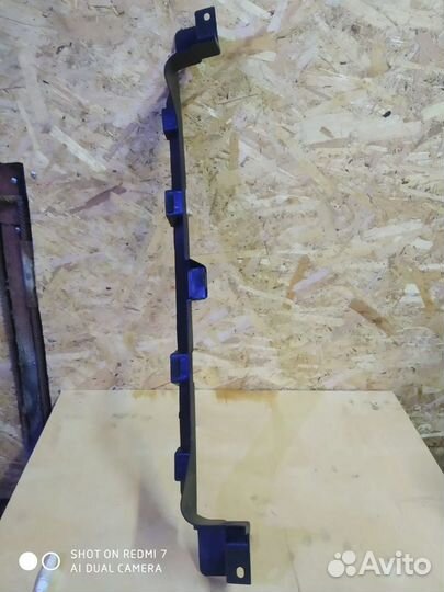 Кронштейн переднего бампера Мазда