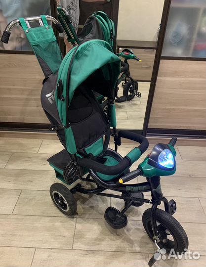 Трехколесный велосипед-коляска с ручкой