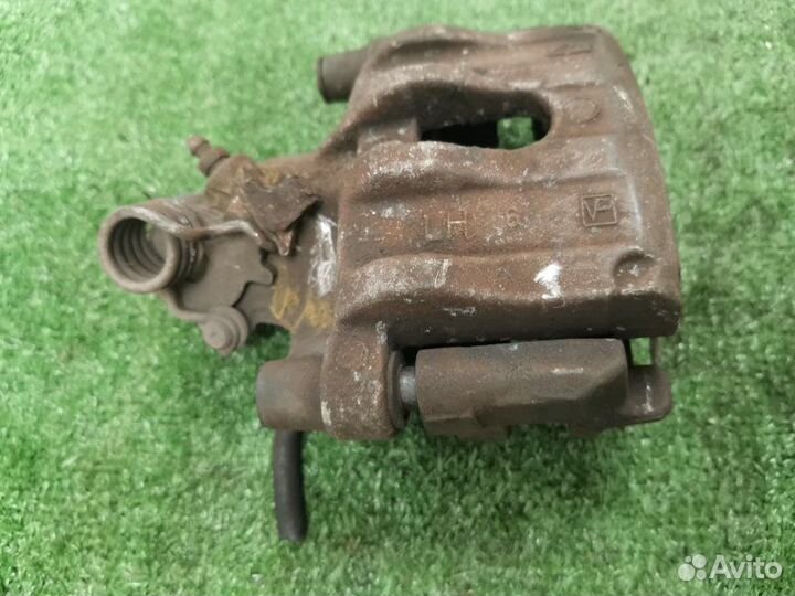 Суппорт тормозной задний левый Ford Focus 2 1.6